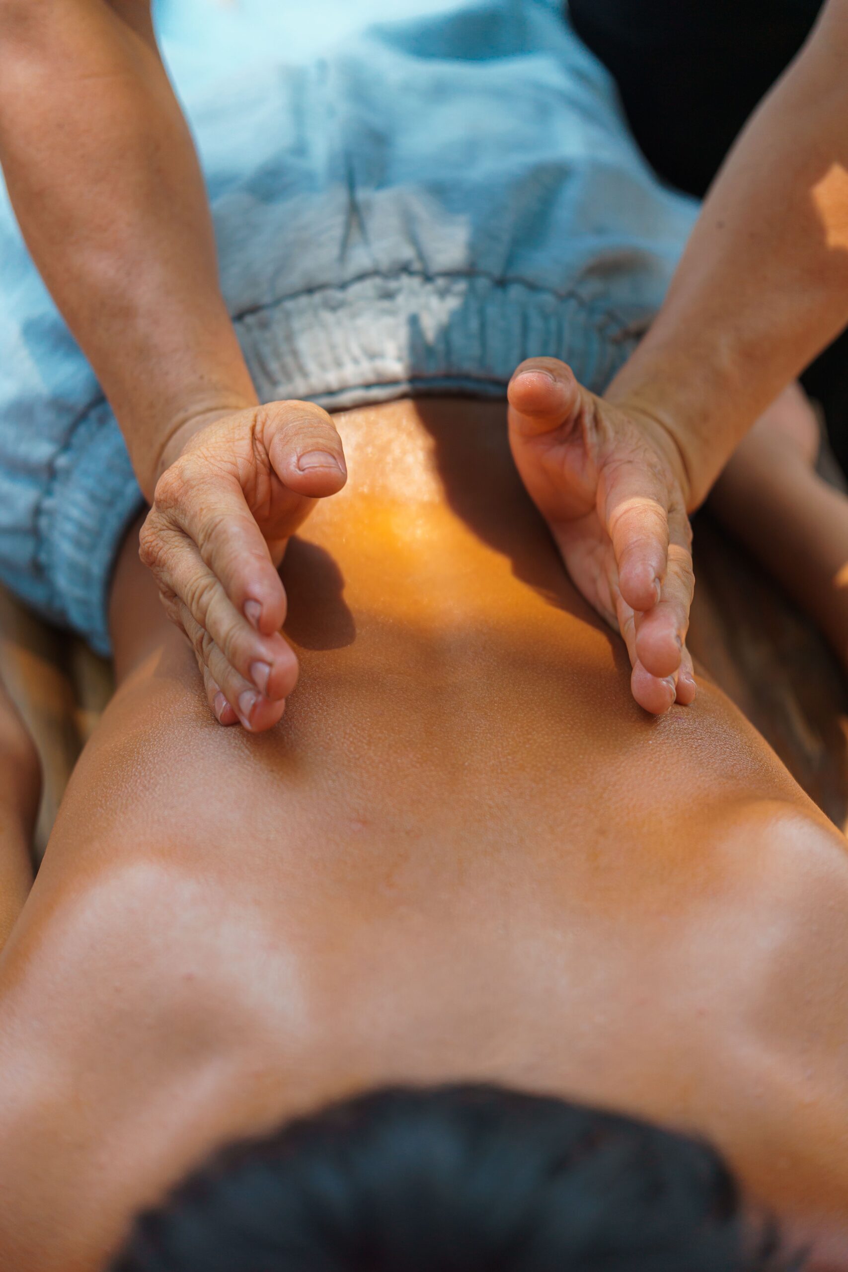 A relaxing back massage therapy session outdoors, capturing the essence of relaxation and wellness.